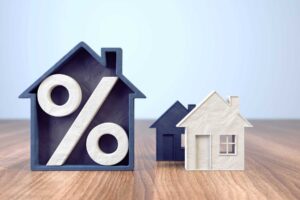 a house and a house with percentage signs on it