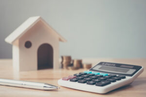 a calculaer and a pen on a table