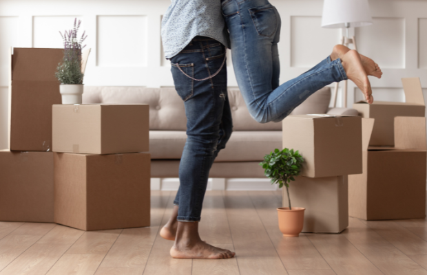 a man is jumping in the air with boxes around him