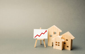 a house and a small house with a red arrow pointing up