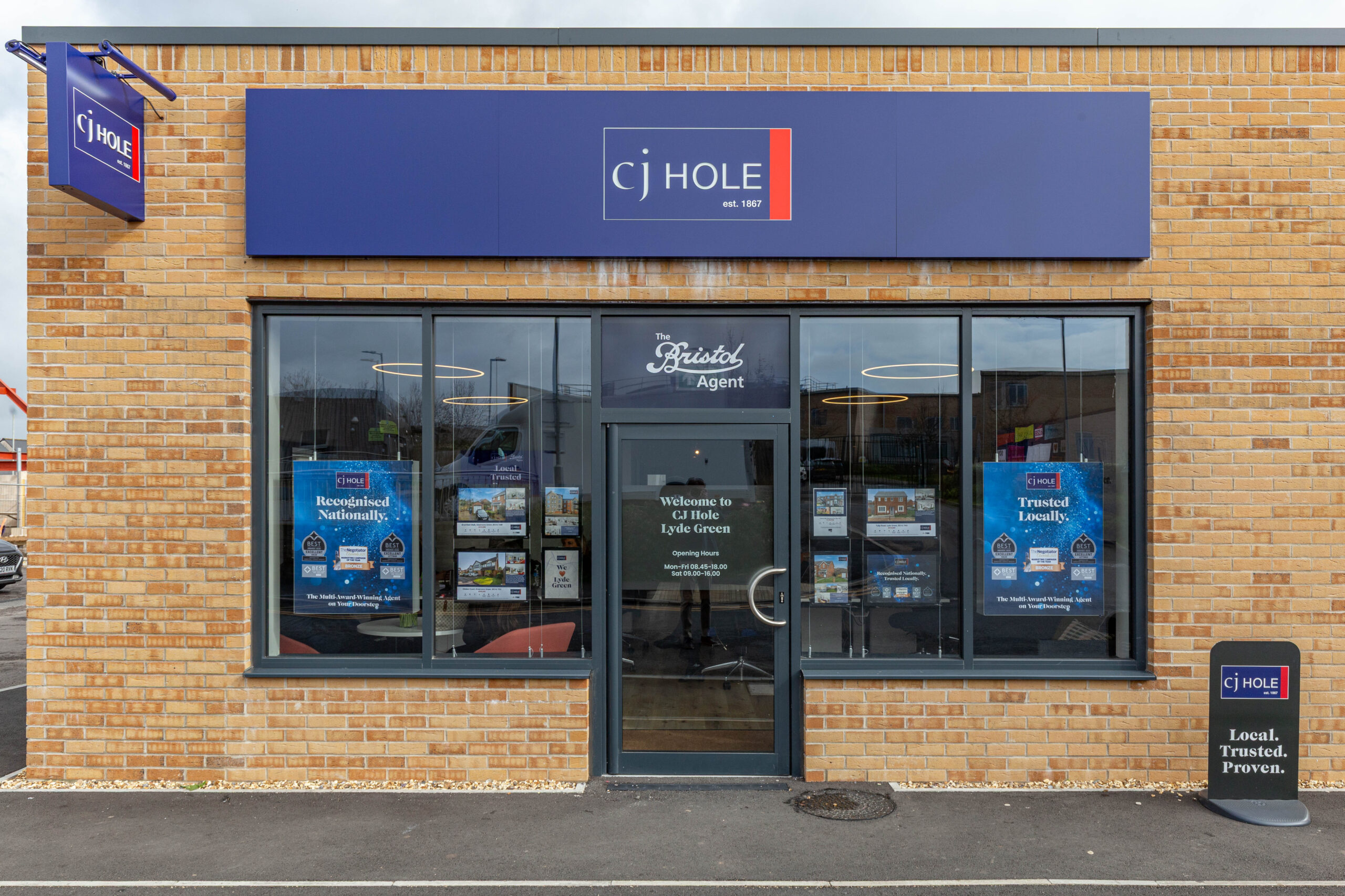 Exterior view of CJ Hole Lyde Green estate agent office.