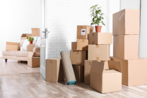 a room with cardboard boxes and a couch