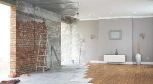 a room with a brick wall and a wooden floor