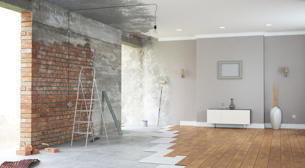 a room with a brick wall and a wooden floor