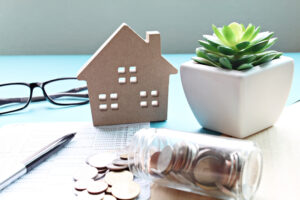 a small house shaped planter sitting on top of a table