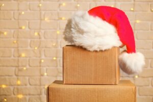 a santa hat on top of a cardboard box