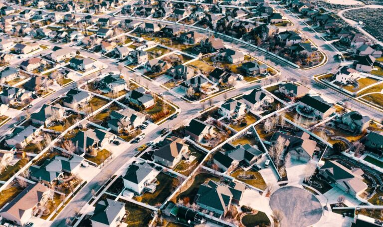 Aerial view of a large suburban housing development, highlighting property trends as we look towards 2026 after a base rate cut.