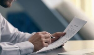 Landlord reviewing rental income documents for Making Tax Digital reporting