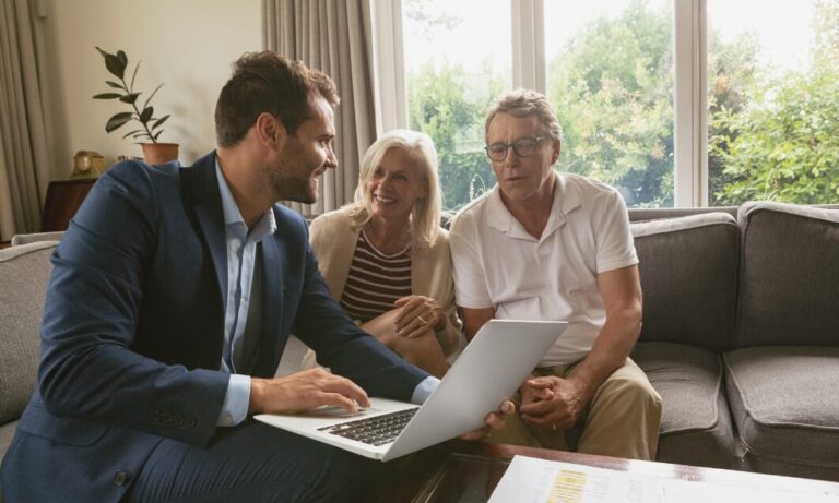 Landlord or letting agent discussing rental property investment with a couple in Brislington