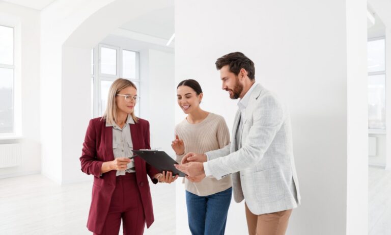 Estate agent reviewing property details with clients inside a bright rental property, representing Bishopsworth Bristol rental yields, landlord advice and BS13 buy-to-let investment.