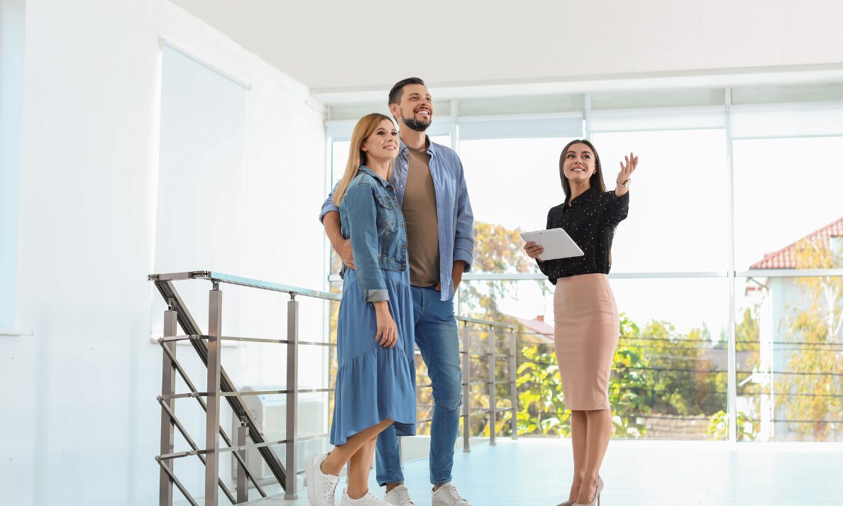 Letting agent showing a couple around a bright rental property, representing Bishopsworth landlords adapting to the 2026 rental bidding ban.
