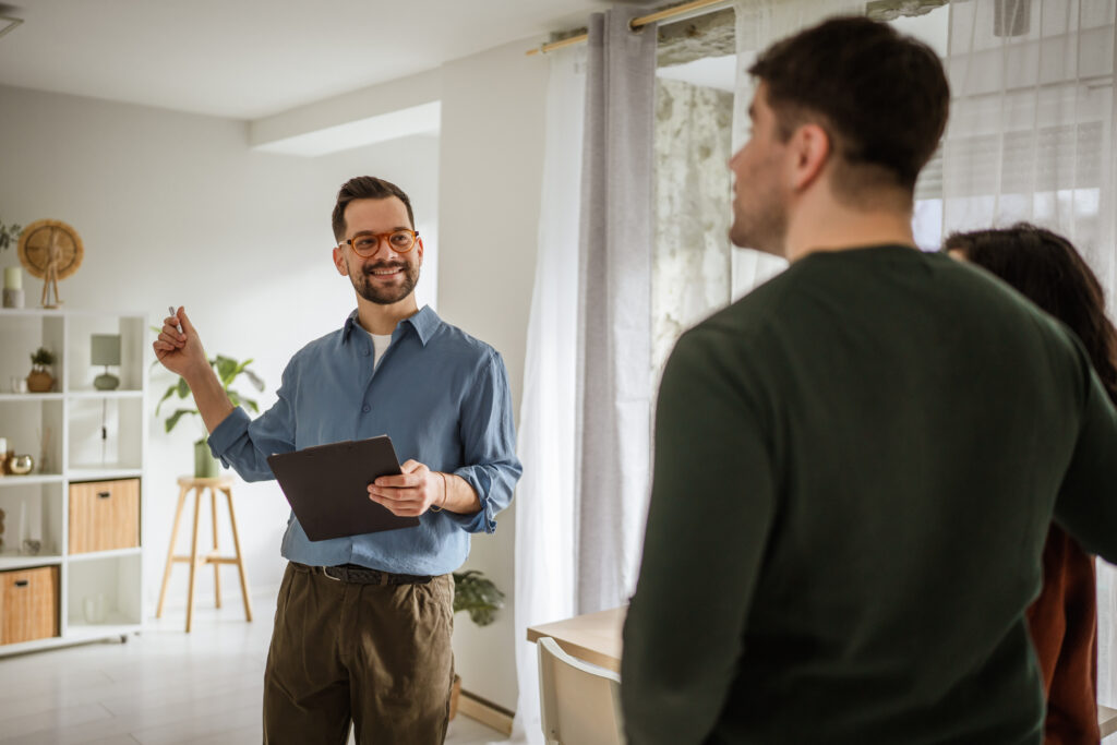 Estate agent discussing a property valuation with homeowners during a house visit in Brislington.