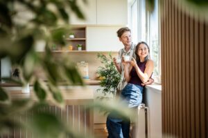Couple enjoying a bright kitchen in a Long Ashton home