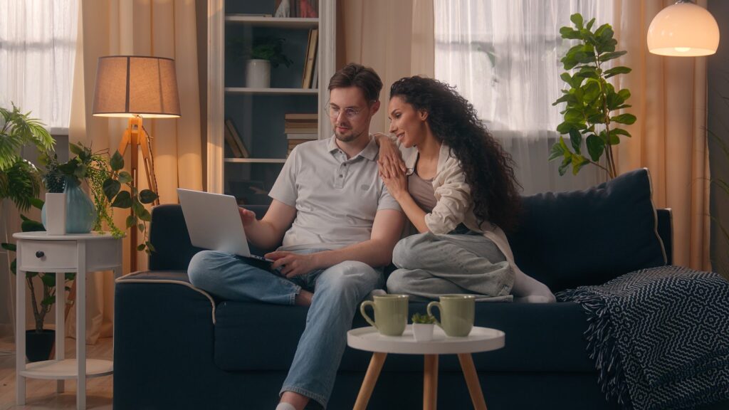 Woman with a mug by the window of a warm, energy-efficient rental home in Southville, Bristol BS3