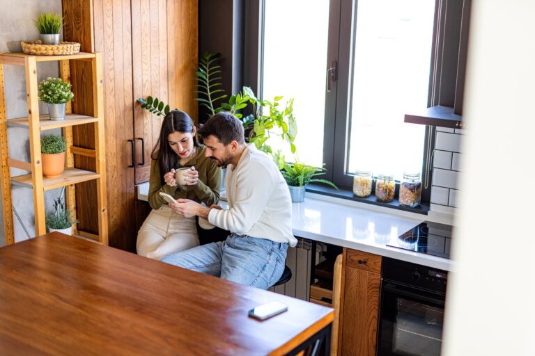 Couple of BS13 landlords reviewing Renters Rights Act changes on a laptop at their kitchen table